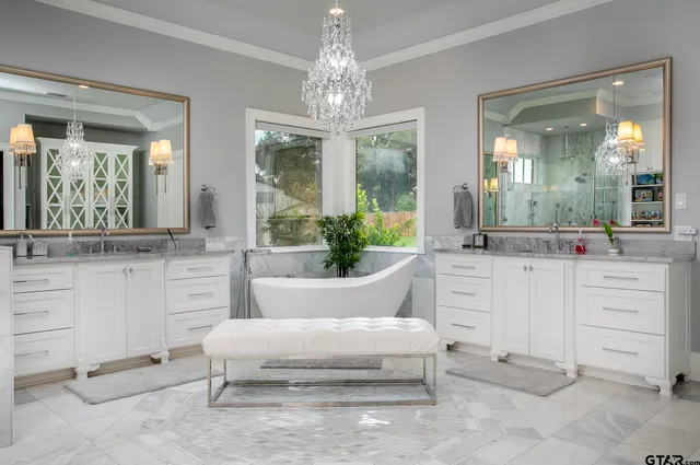 a living room with furniture and a large mirror