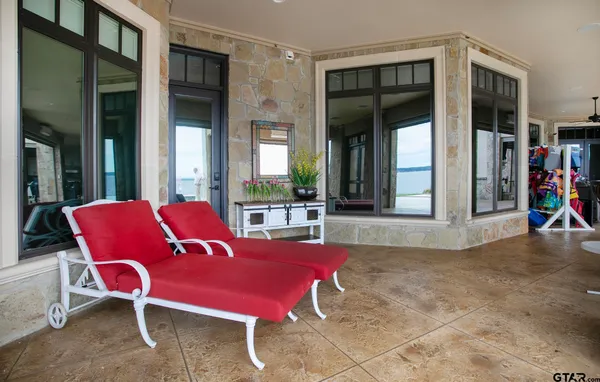 a view of a house with porch and sitting area