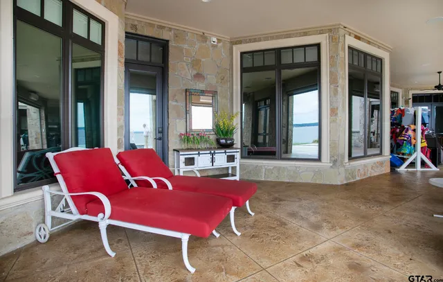 a view of a house with porch and sitting area