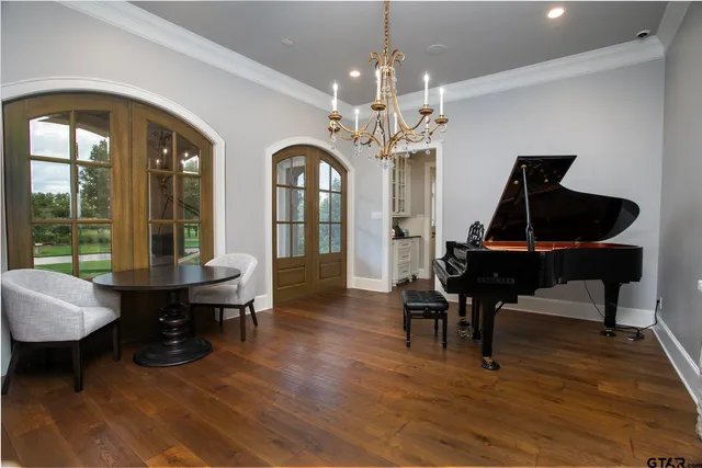 a view of a livingroom with furniture window and wooden floor