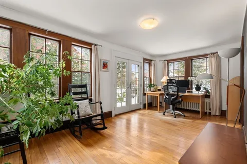 a view of a livingroom with furniture and a window