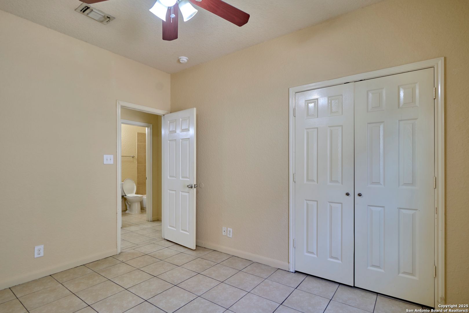 10911 Baltic Drive, Unit 102 San Antonio, TX 78213 - Photo 14 of 23 wooden floor in an empty room with a bathroom
