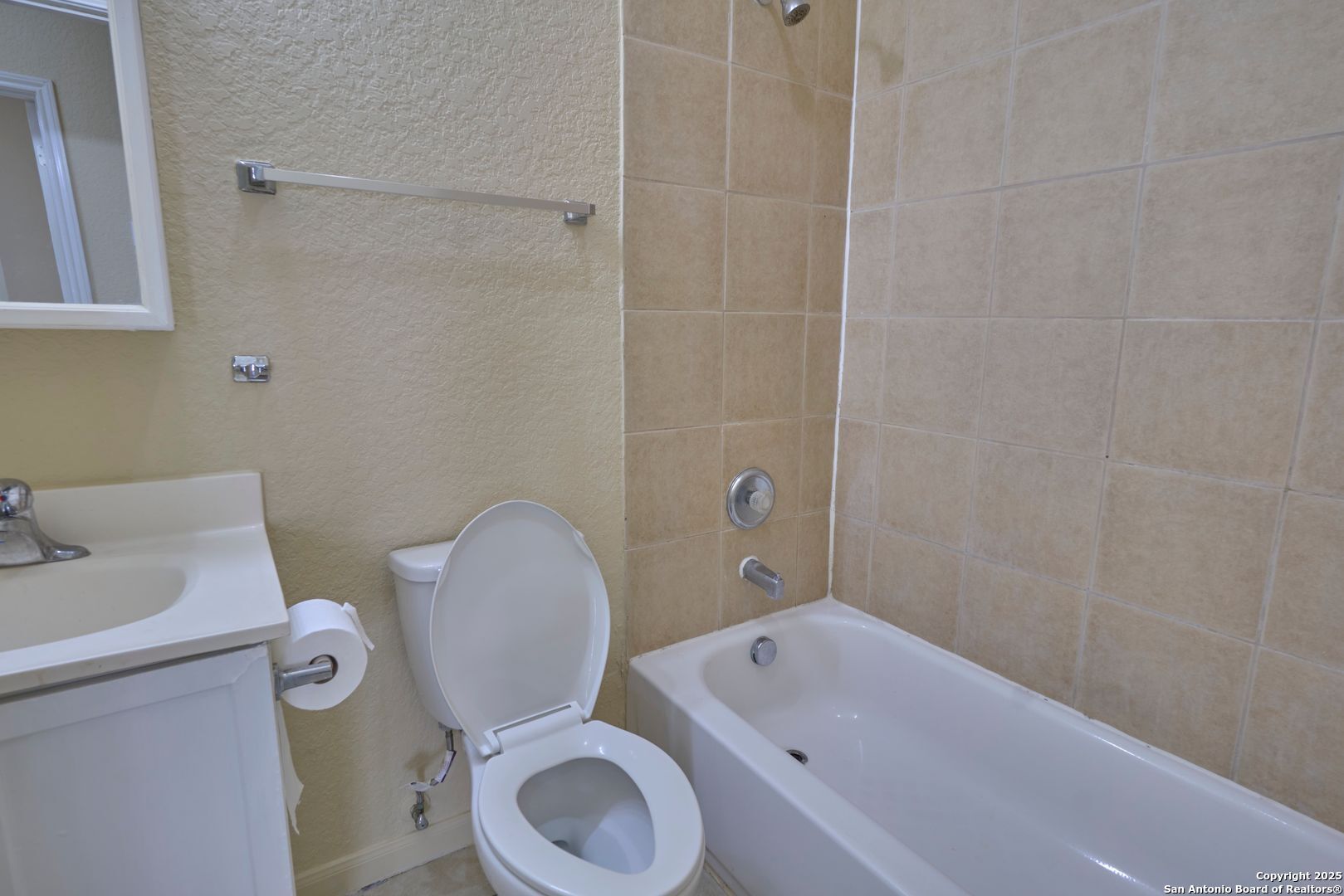 10911 Baltic Drive, Unit 102 San Antonio, TX 78213 - Photo 15 of 23 a bathroom with a sink a toilet and bathtub