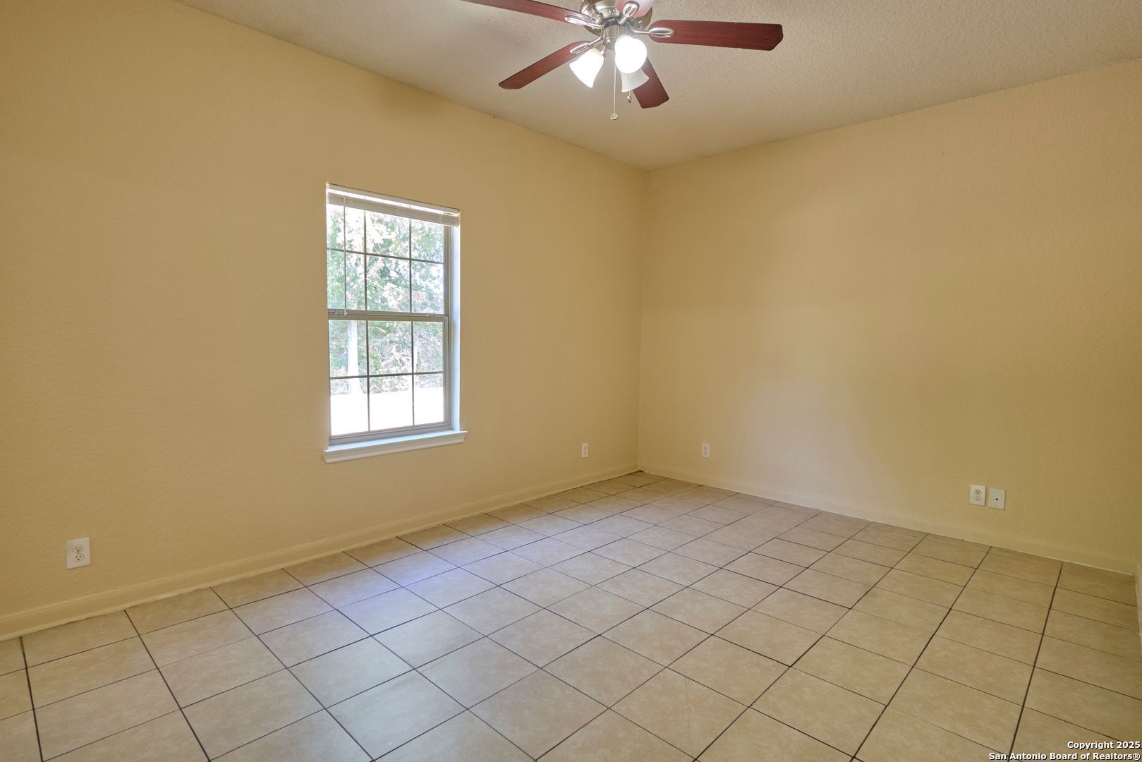 10911 Baltic Drive, Unit 102 San Antonio, TX 78213 - Photo 17 of 23 en empty room with windows