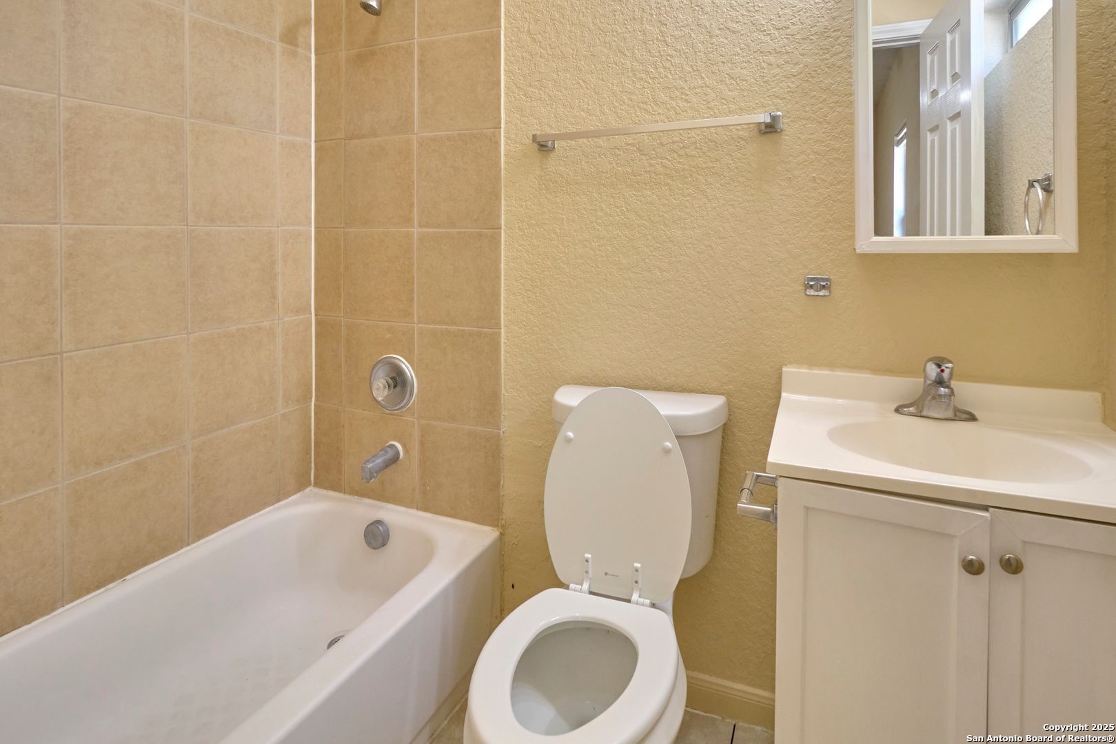 10911 Baltic Drive, Unit 102 San Antonio, TX 78213 - Photo 19 of 23 a bathroom with a sink a toilet and shower