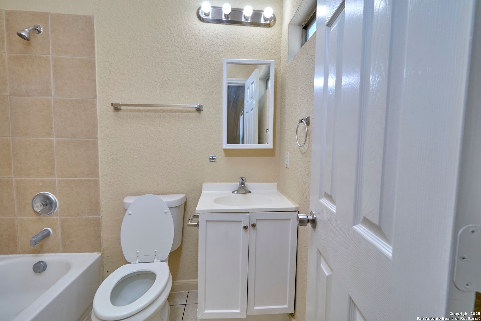 10911 Baltic Drive, Unit 102 San Antonio, TX 78213 - Photo 20 of 23 a bathroom with a sink toilet and shower