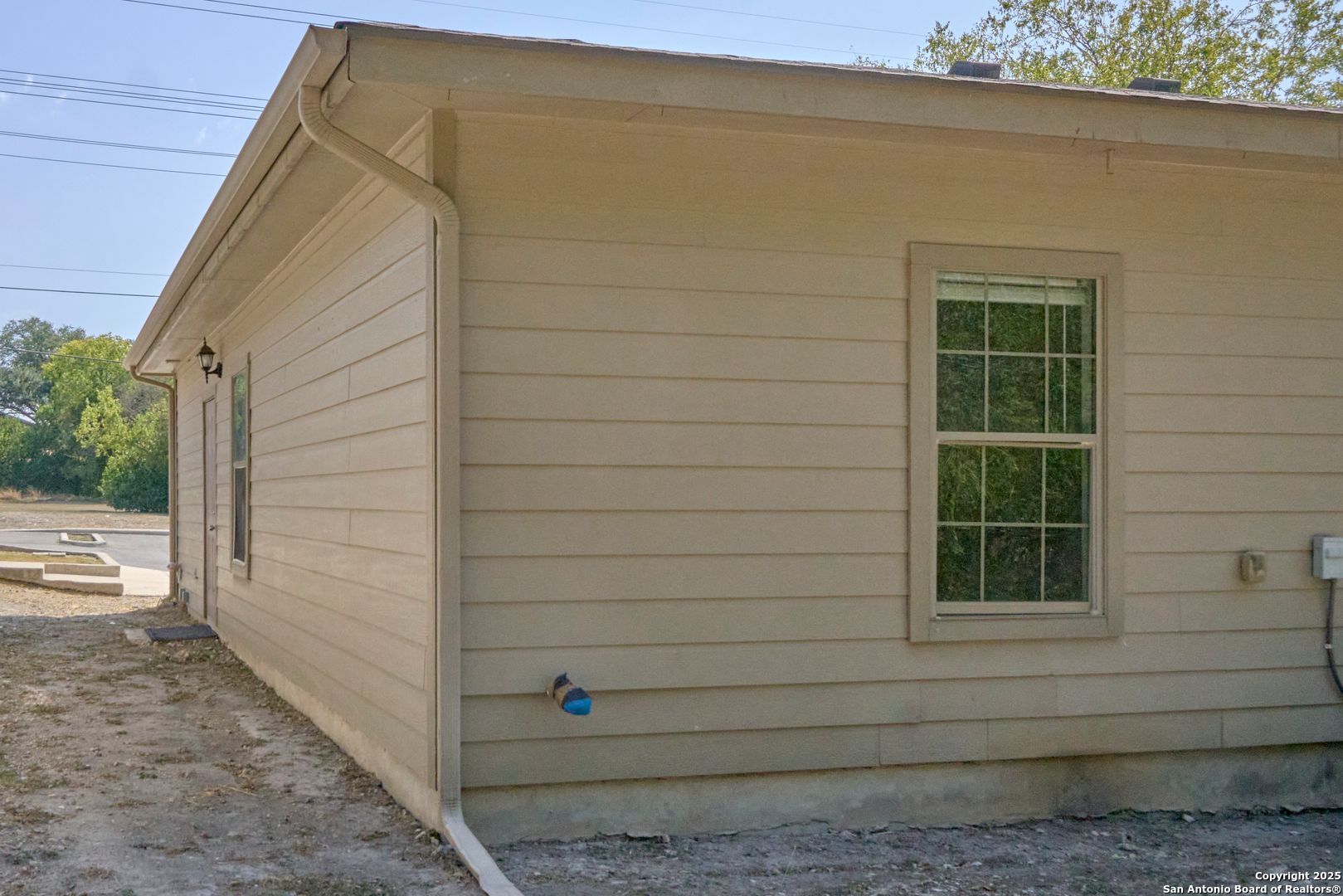 10911 Baltic Drive, Unit 102 San Antonio, TX 78213 - Photo 22 of 23 a view of a house with a large window