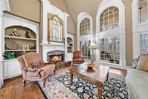 a dining room with furniture and chandelier kitchen view