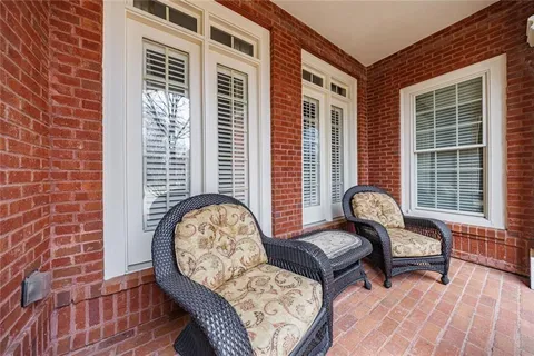 a living room with furniture a fireplace and a table