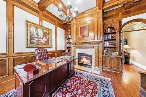 a living room with furniture fireplace and flat screen tv