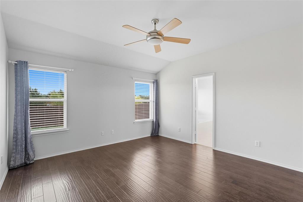 9822 Revolution Way Frisco, TX 75033 - Photo 11 of 29 wooden floor in an empty room with a window