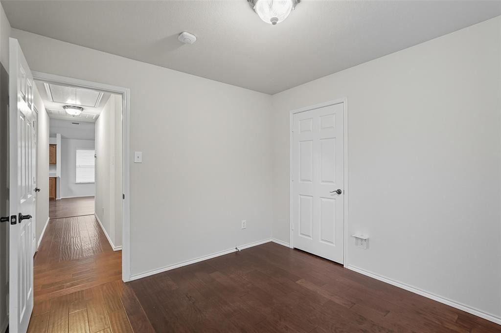 9822 Revolution Way Frisco, TX 75033 - Photo 21 of 29 a view of a room with wooden floor