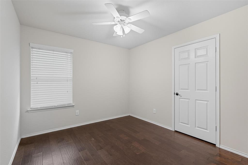 9822 Revolution Way Frisco, TX 75033 - Photo 22 of 29 an empty room with a window and a ceiling fan