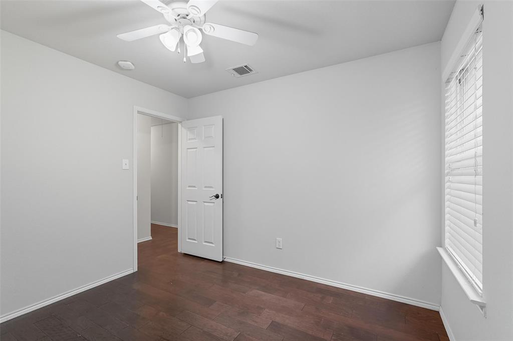 9822 Revolution Way Frisco, TX 75033 - Photo 24 of 29 an empty room with a window and a chandelier