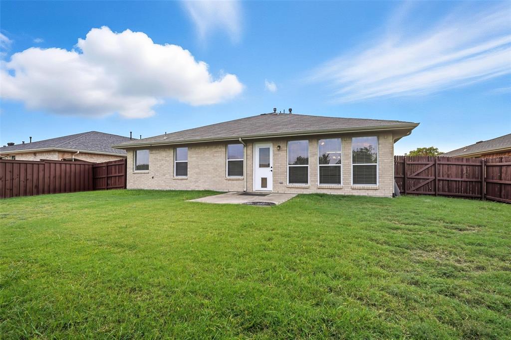 9822 Revolution Way Frisco, TX 75033 - Photo 26 of 29 a view of a house with a backyard