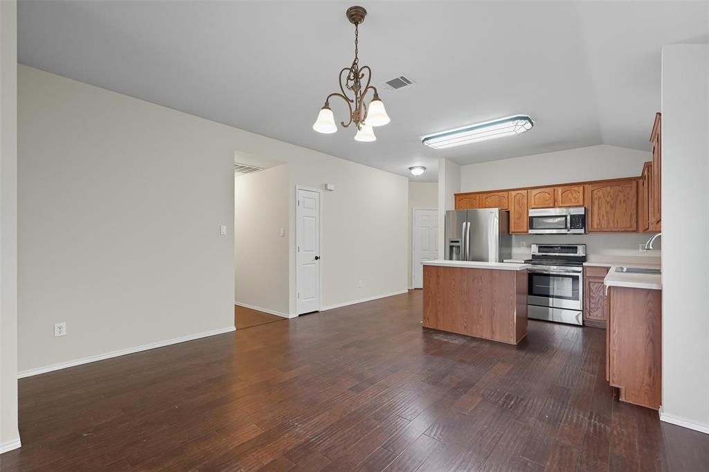 9822 Revolution Way Frisco, TX 75033 - Photo 28 of 29 a view of kitchen with sink refrigerator and microwave
