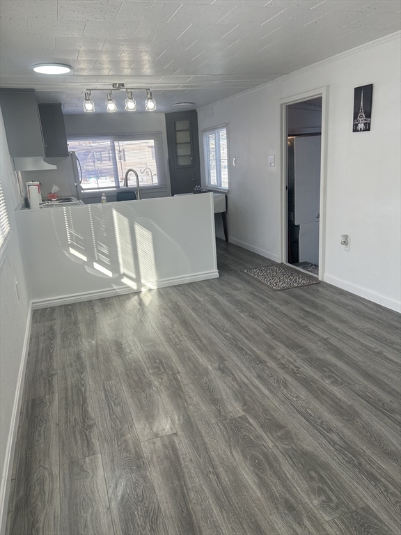 1237 Central Street, Unit 15 Leominster, MA 01453 - Photo 18 of 25 a view of a kitchen with cabinets and wooden floor