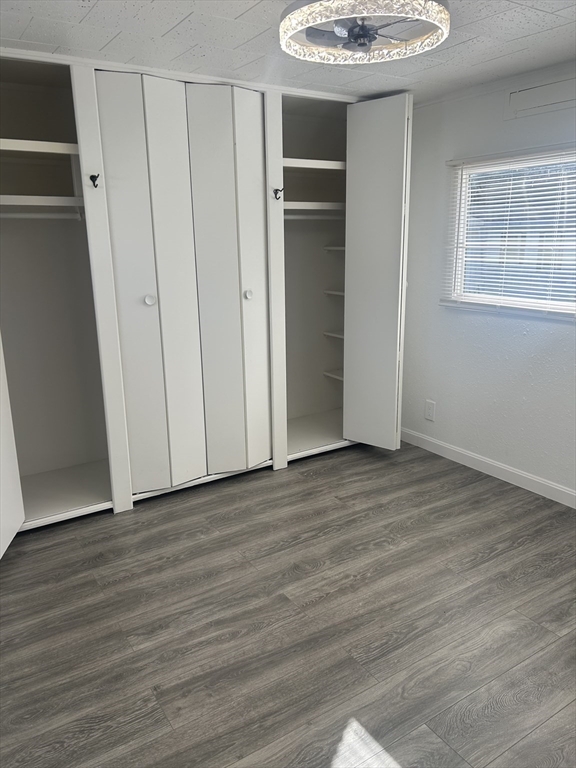 1237 Central Street, Unit 15 Leominster, MA 01453 - Photo 5 of 25 a view of a room with wooden floor and a window