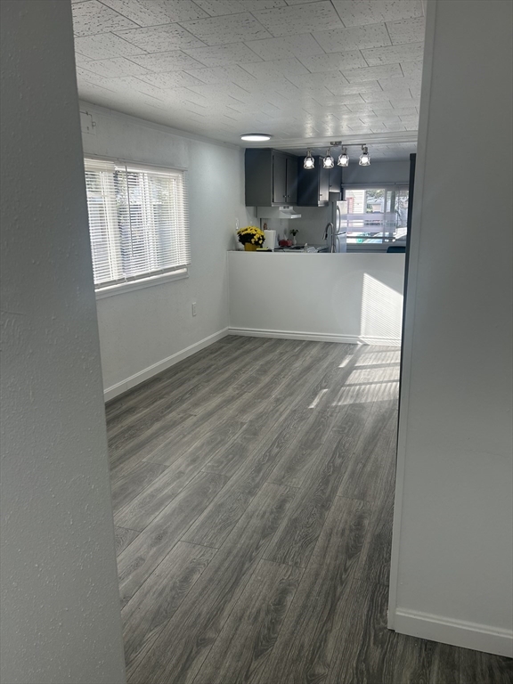 1237 Central Street, Unit 15 Leominster, MA 01453 - Photo 6 of 25 a view of a hallway to room and window