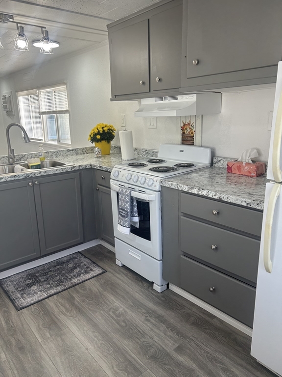 1237 Central Street, Unit 15 Leominster, MA 01453 - Photo 8 of 25 a kitchen with granite countertop a stove a sink and dishwasher