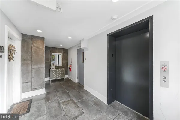 a view of a hallway with bathroom