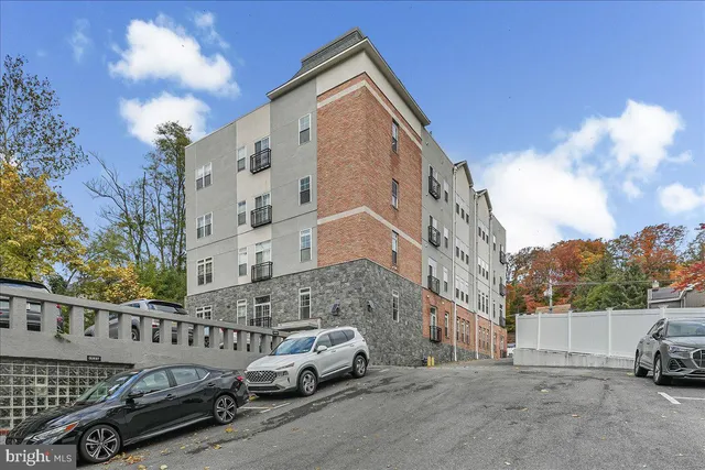 a view of a car parked in front of a building