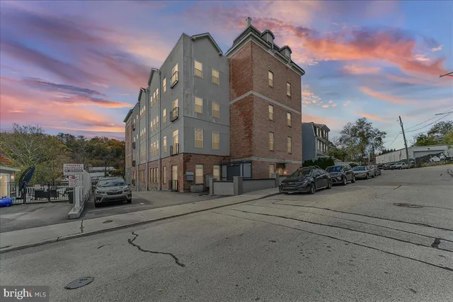 a view of a street with cars