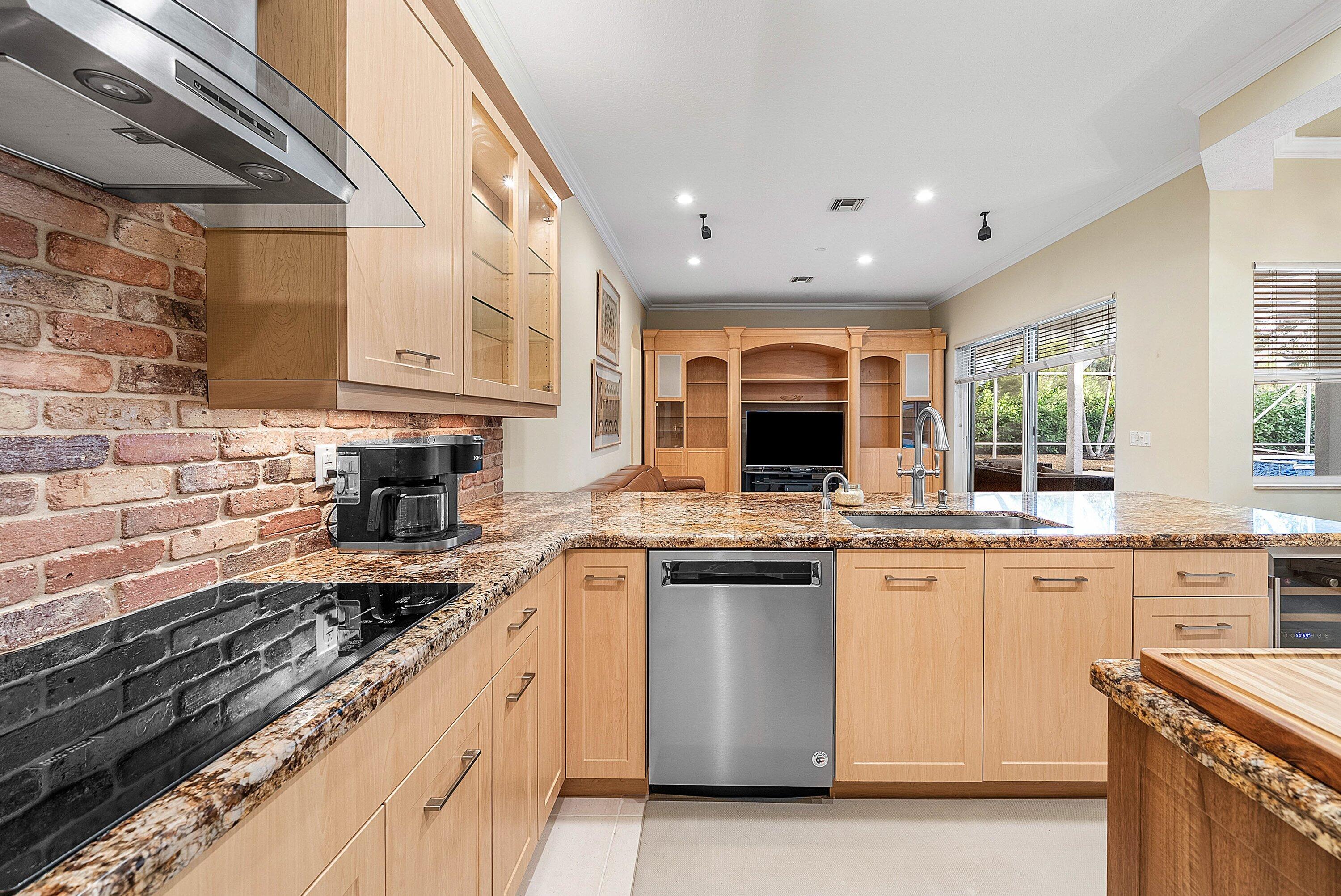 21374 Falls Ridge Way Boca Raton, FL 33428 - Photo 15 of 69 a kitchen with stainless steel appliances granite countertop a stove sink and cabinets