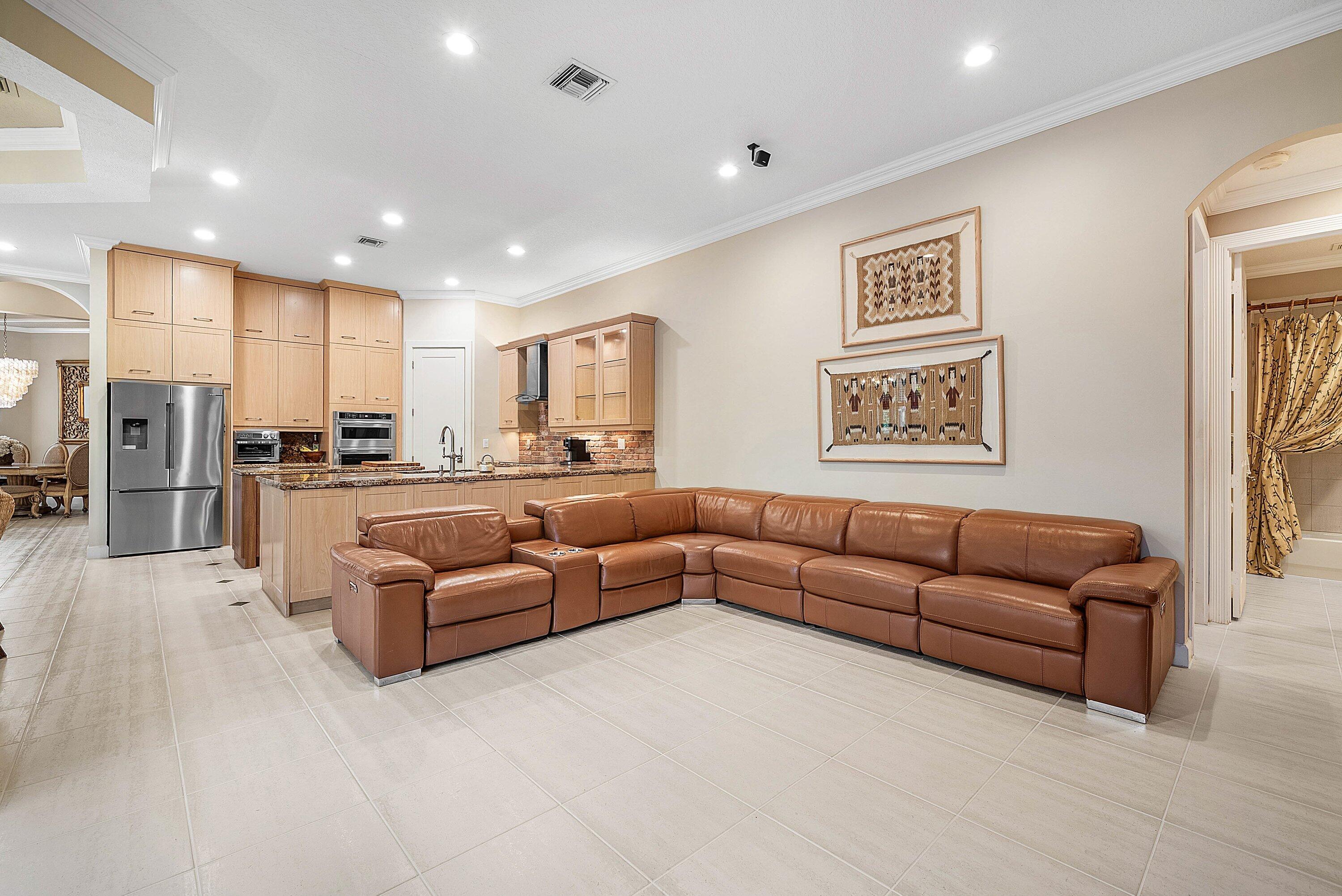 21374 Falls Ridge Way Boca Raton, FL 33428 - Photo 18 of 69 a living room with couches and kitchen view