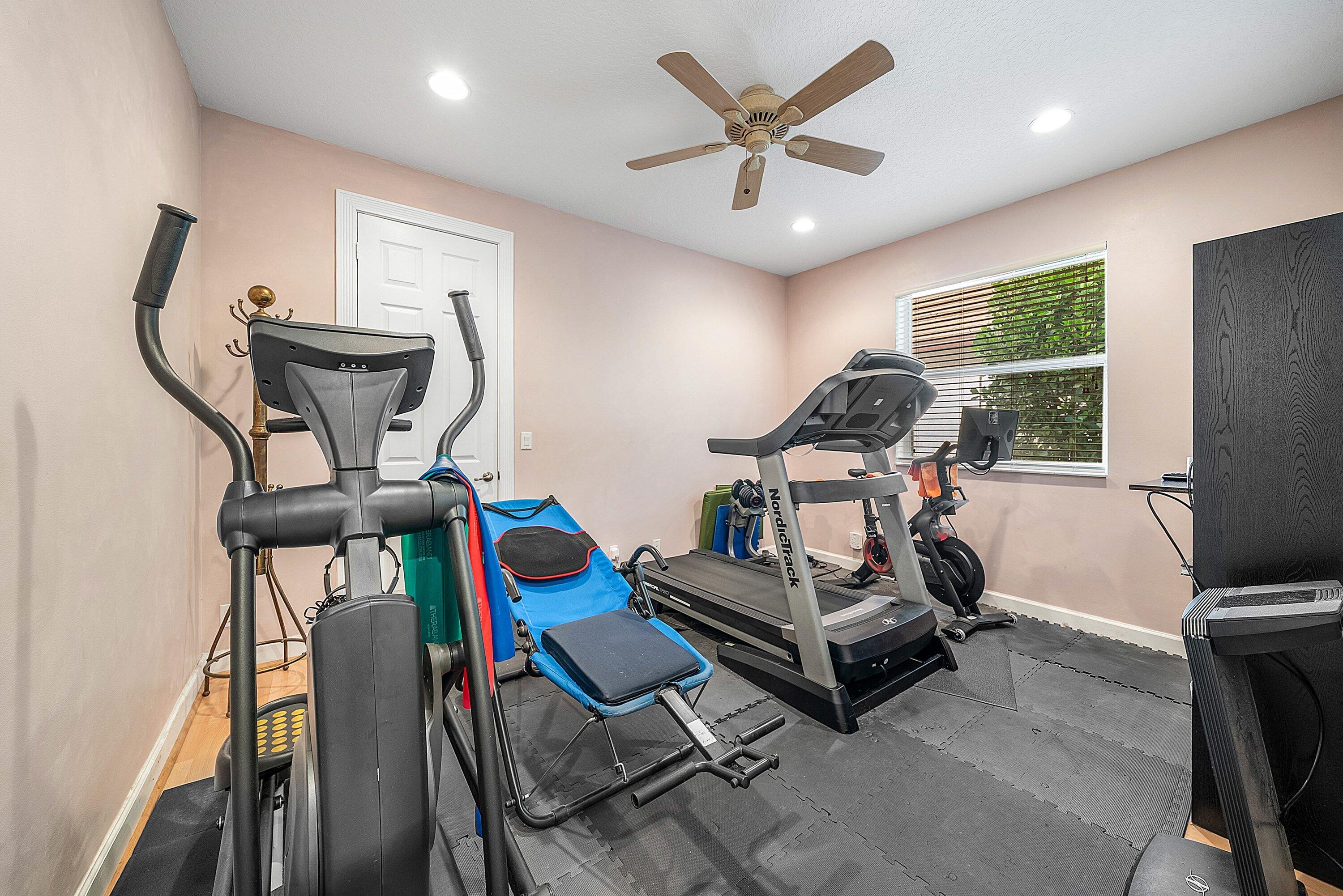 21374 Falls Ridge Way Boca Raton, FL 33428 - Photo 25 of 69 a view of a room with gym equipment