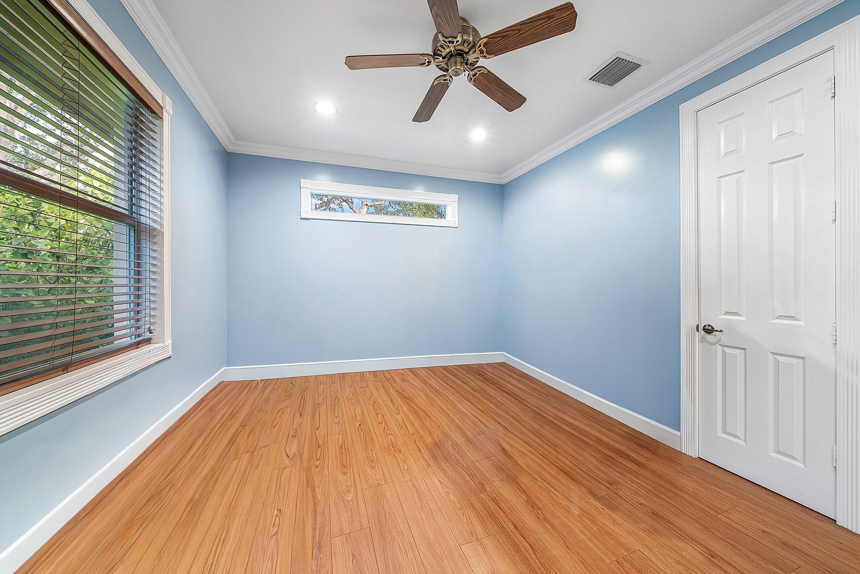 21374 Falls Ridge Way Boca Raton, FL 33428 - Photo 27 of 69 an empty room with wooden floor fan and windows