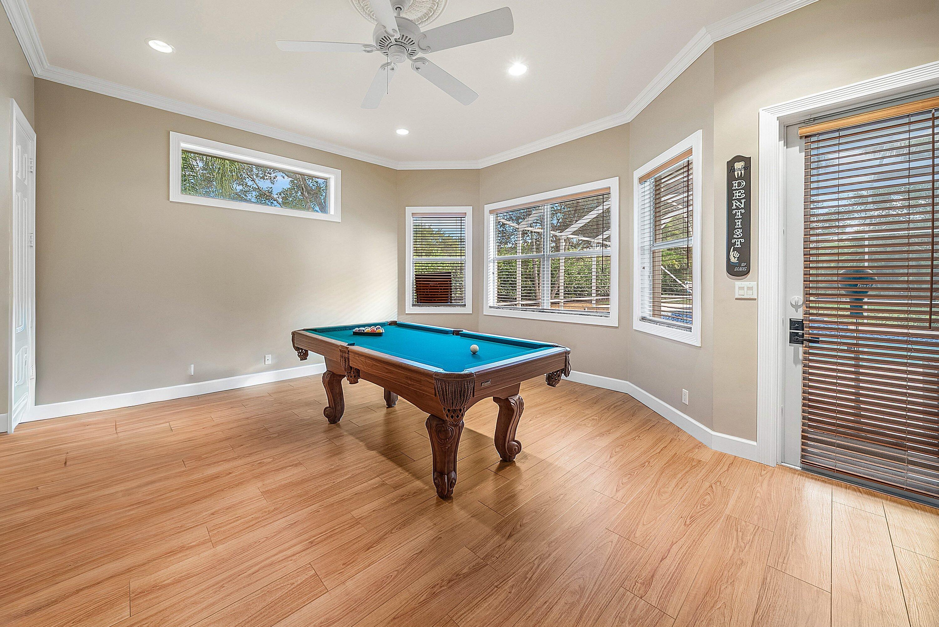 21374 Falls Ridge Way Boca Raton, FL 33428 - Photo 29 of 69 a room with wooden floor and windows