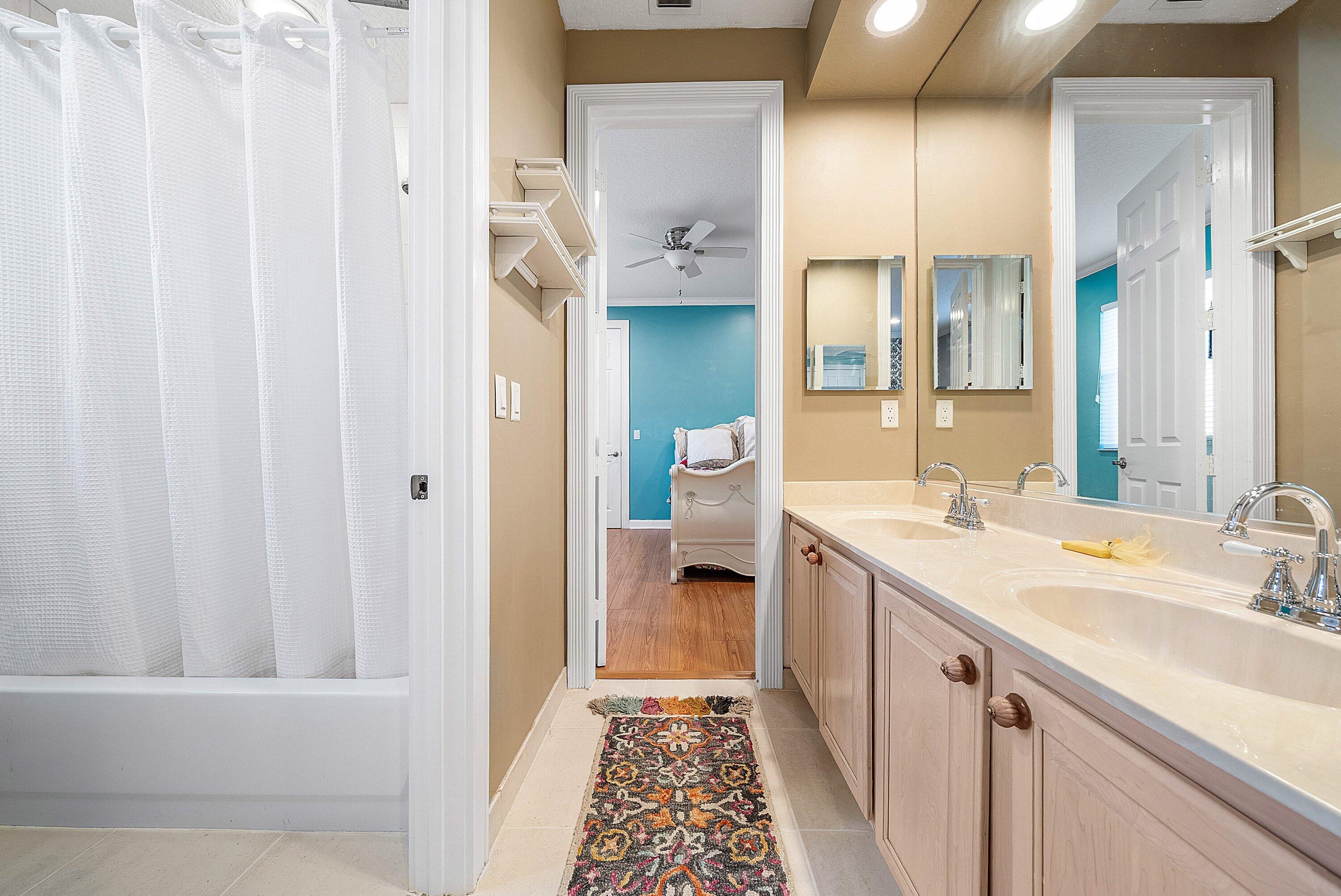 21374 Falls Ridge Way Boca Raton, FL 33428 - Photo 35 of 69 a bathroom with a sink a mirror and a shower