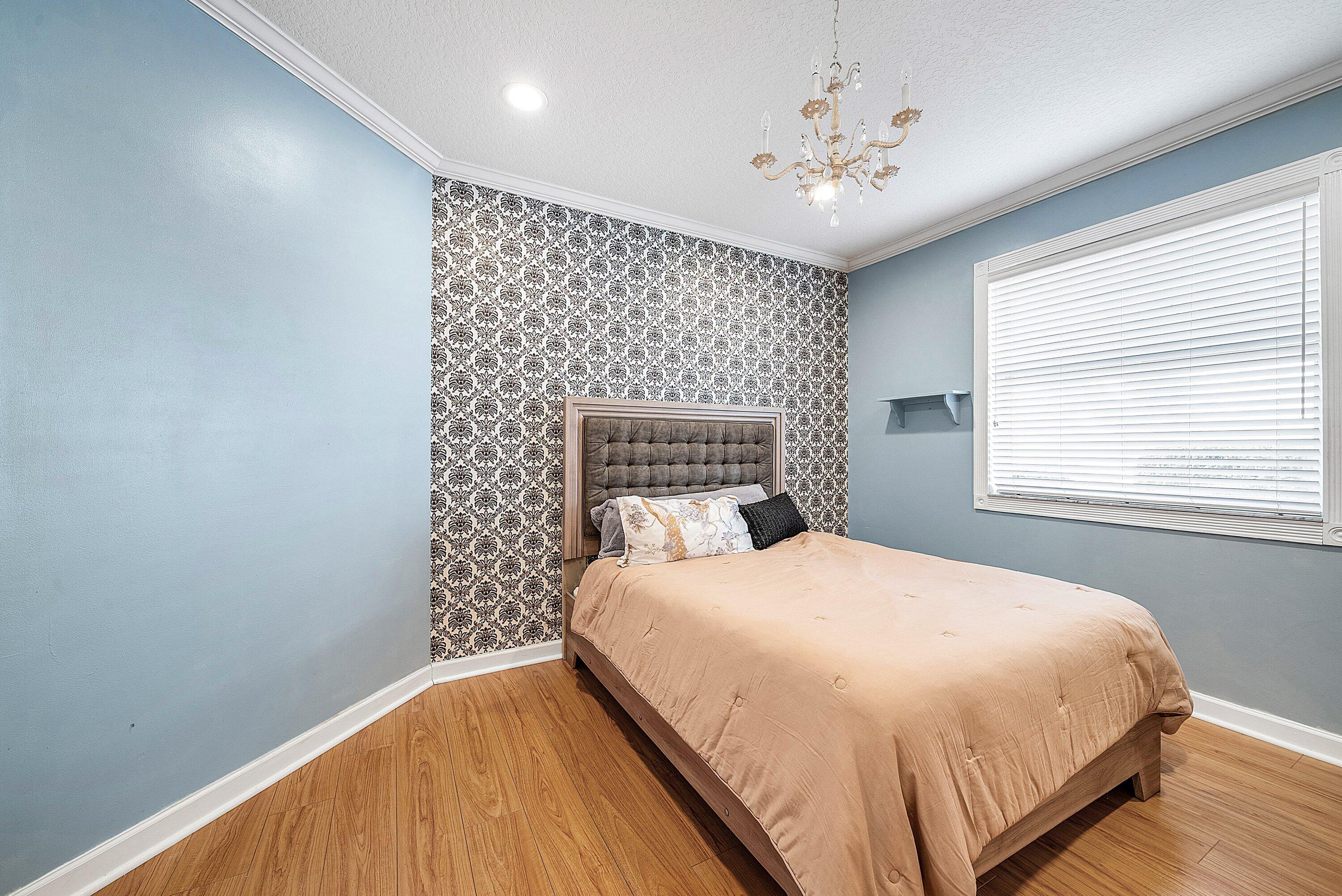 21374 Falls Ridge Way Boca Raton, FL 33428 - Photo 36 of 69 a bedroom with a bed and a window