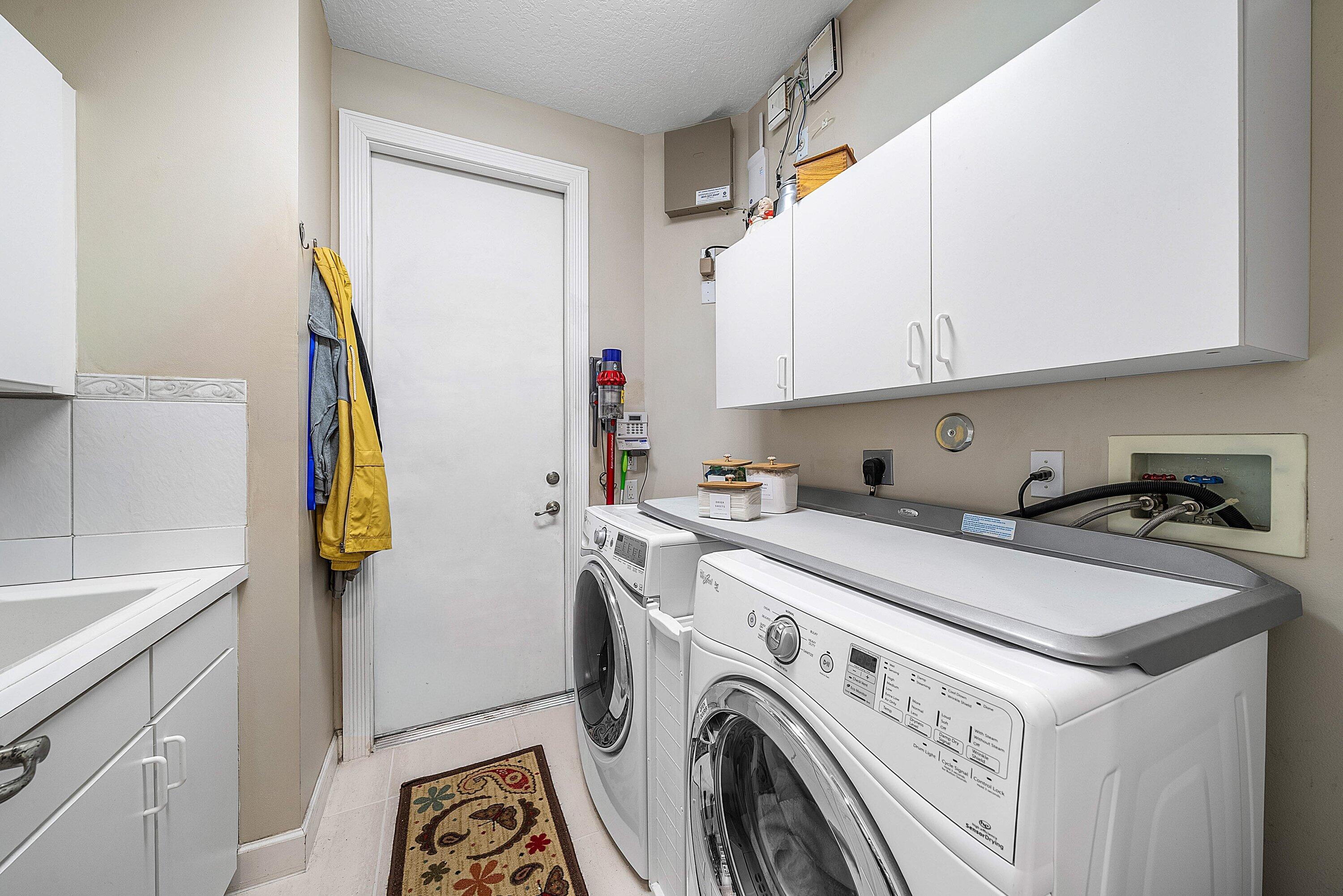 21374 Falls Ridge Way Boca Raton, FL 33428 - Photo 39 of 69 a utility room with dryer and washer