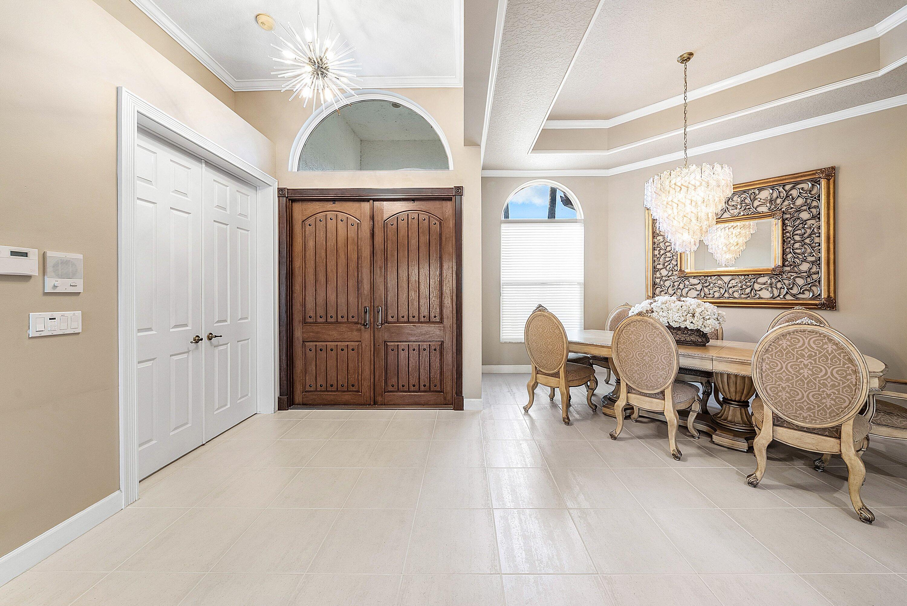 21374 Falls Ridge Way Boca Raton, FL 33428 - Photo 4 of 69 a living room with furniture a window and a chandelier