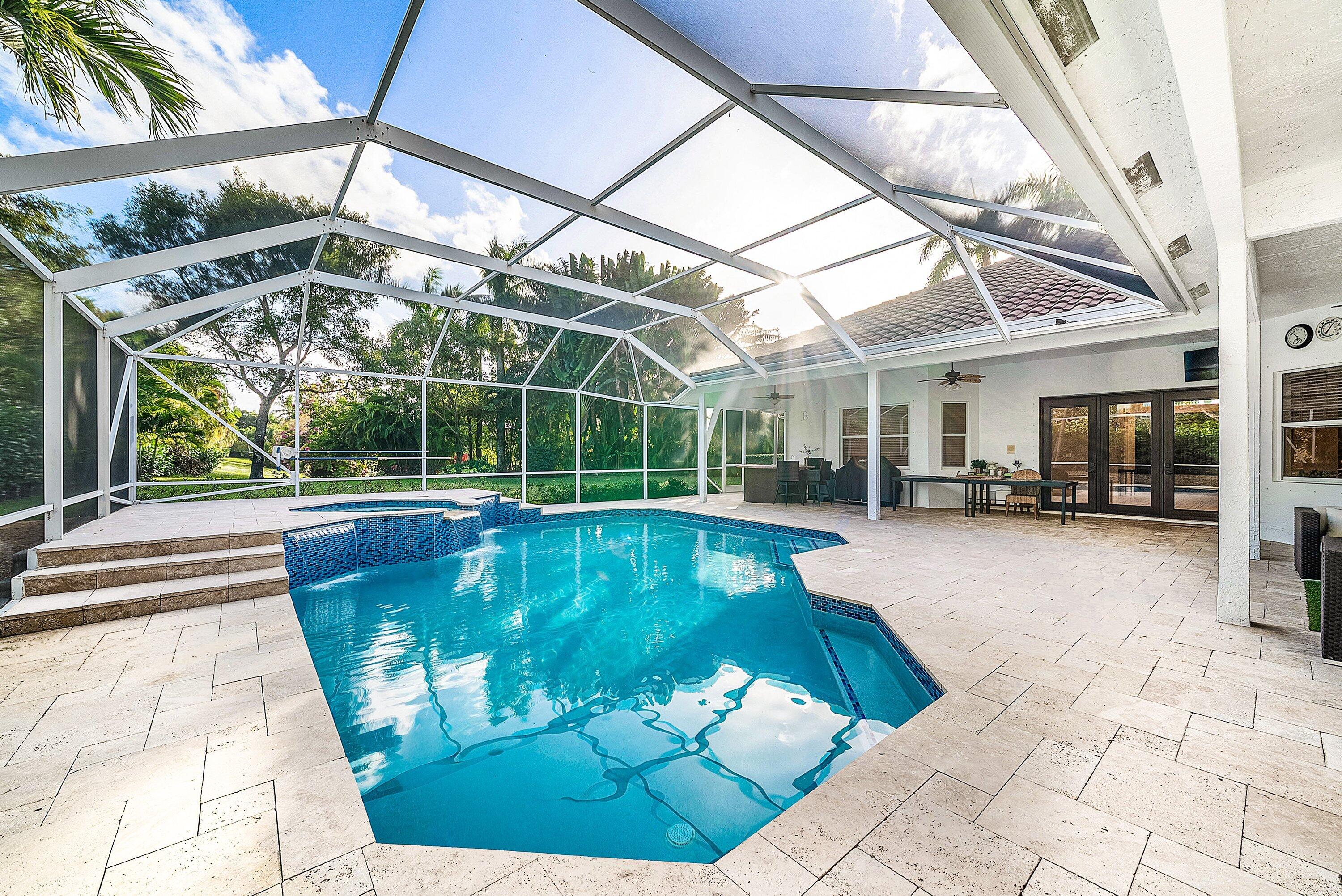 21374 Falls Ridge Way Boca Raton, FL 33428 - Photo 43 of 69 a view of a swimming pool with a patio