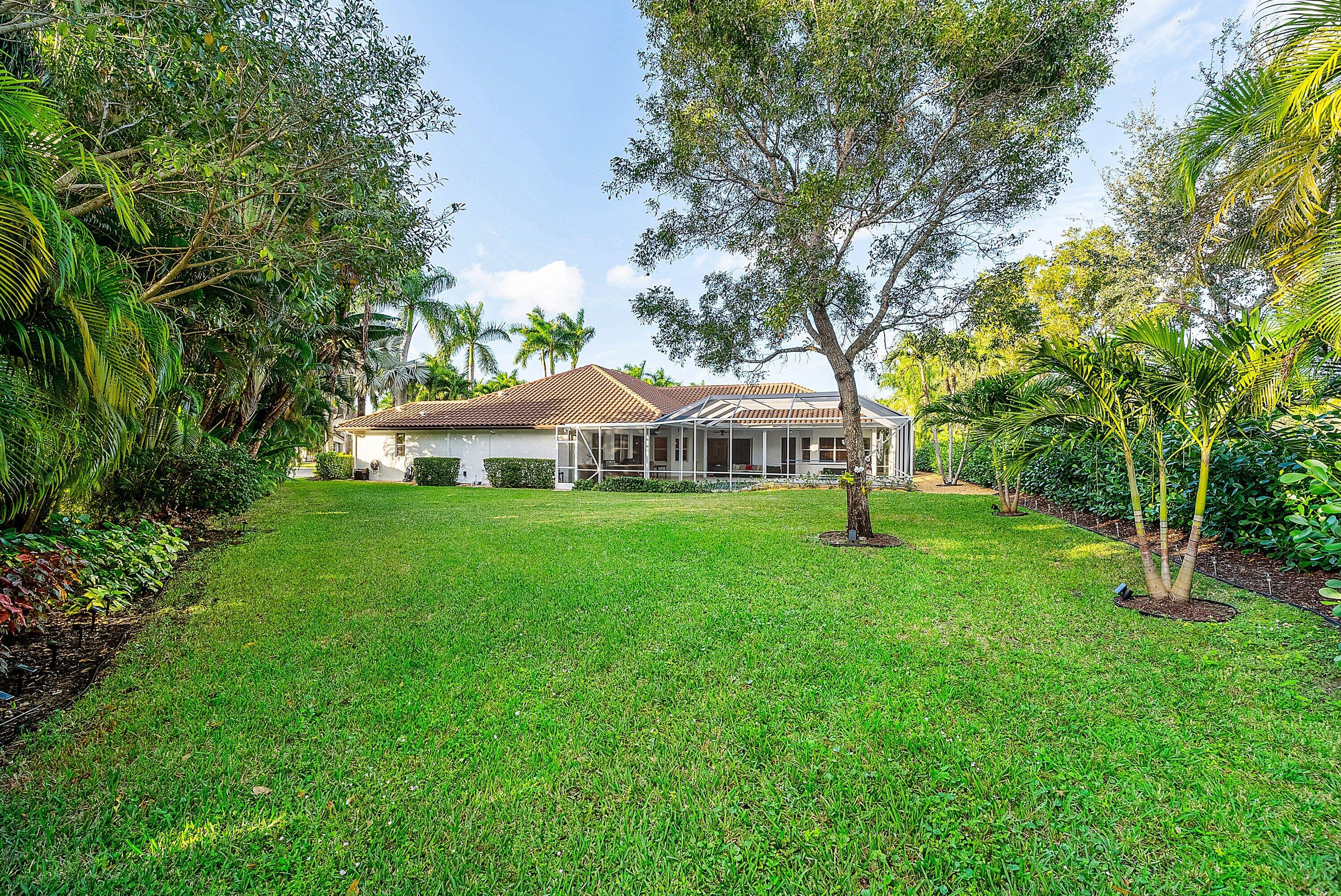21374 Falls Ridge Way Boca Raton, FL 33428 - Photo 47 of 69 a view of an house with backyard space and garden