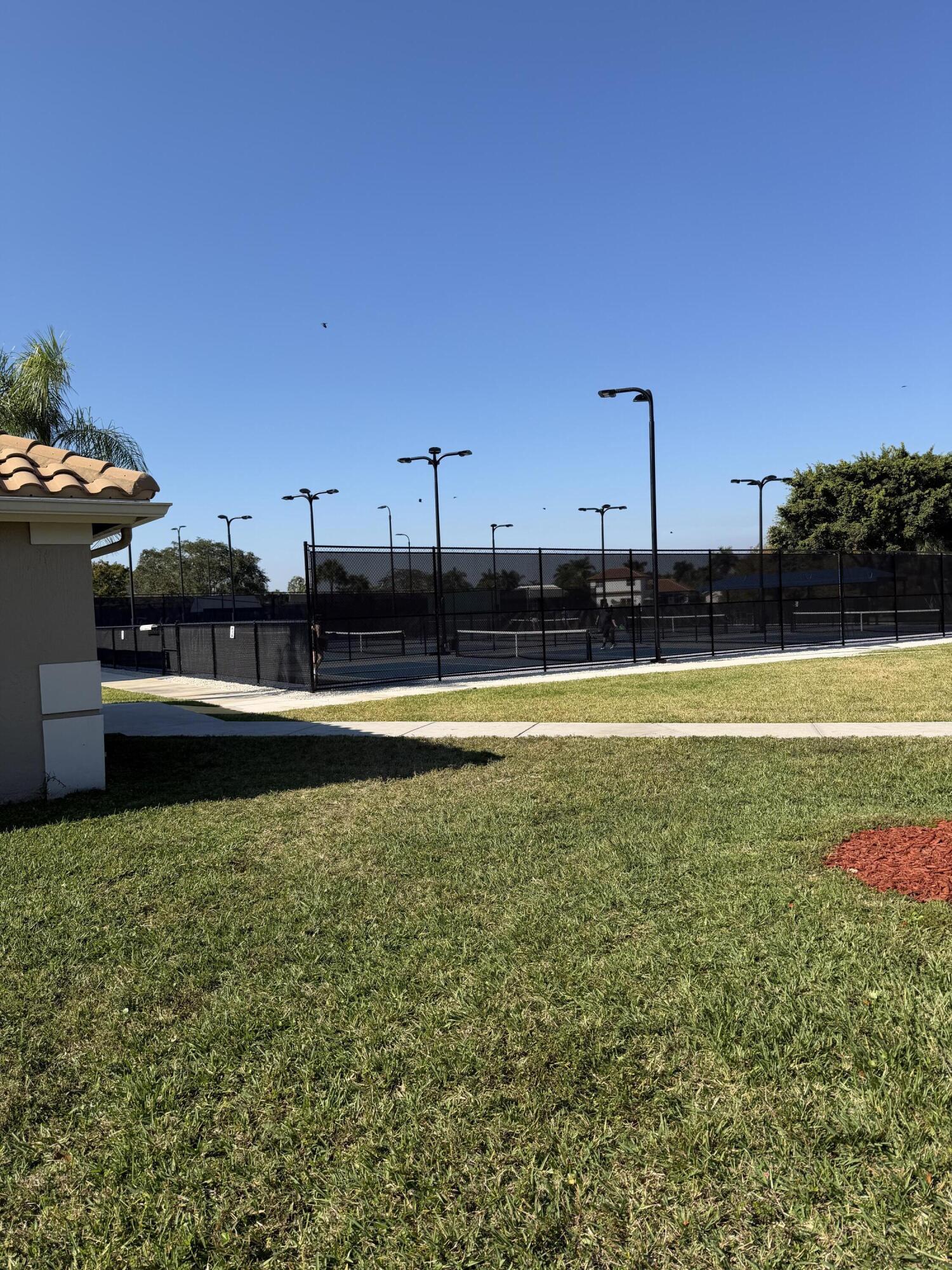 21374 Falls Ridge Way Boca Raton, FL 33428 - Photo 61 of 69 a view of a swimming pool with an outdoor seating and deck