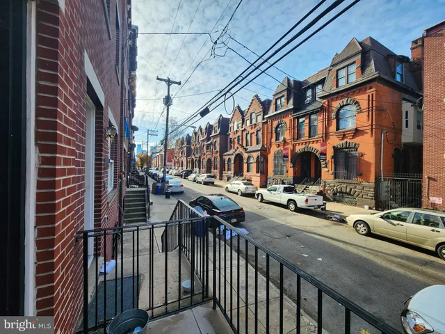 a view of a brick building with many windows