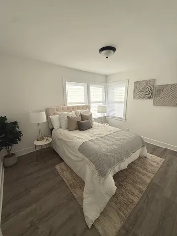 a bedroom with a bed and window