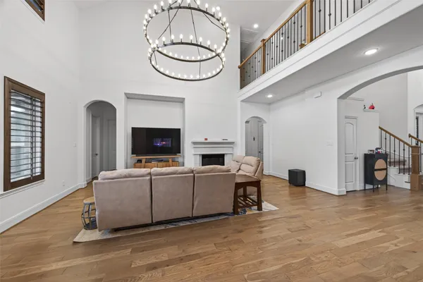 a kitchen with a sink and a large mirror