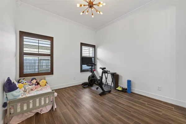 a bedroom with a bed and a chair