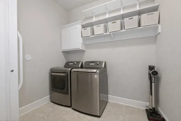 a bathroom with a granite countertop sink a toilet and a large mirror