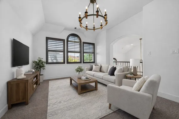 a bed room with furniture and a window