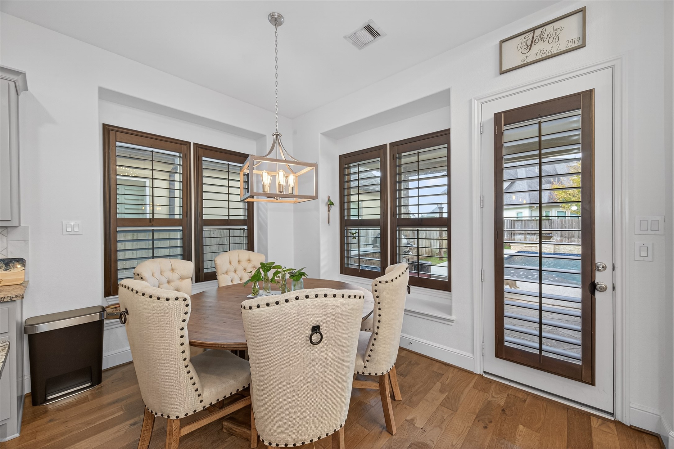 7014 Prairie Grass Lane Katy, TX 77493 - Photo 10 of 49 a view of a dining room with furniture window and wooden floor