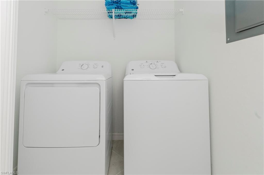 15285 Grn Acrs Avenue, Unit 418 Babcock Ranch, FL 33982 - Photo 28 of 49 a utility room with dryer and washer