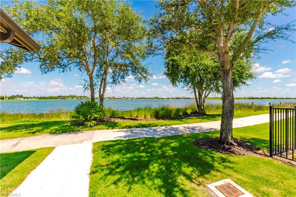 15285 Grn Acrs Avenue, Unit 418 Babcock Ranch, FL 33982 - Photo 38 of 49 a view of swimming pool with a yard