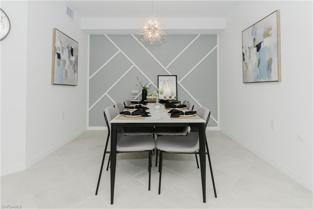 15285 Grn Acrs Avenue, Unit 418 Babcock Ranch, FL 33982 - Photo 6 of 49 a view of a dining room with furniture