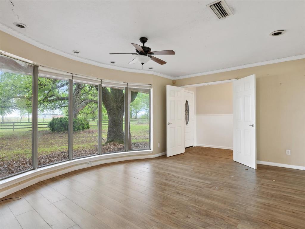 1302 Forreston Road Waxahachie, TX 75165 - Photo 18 of 39 wooden floor in an empty room with a window